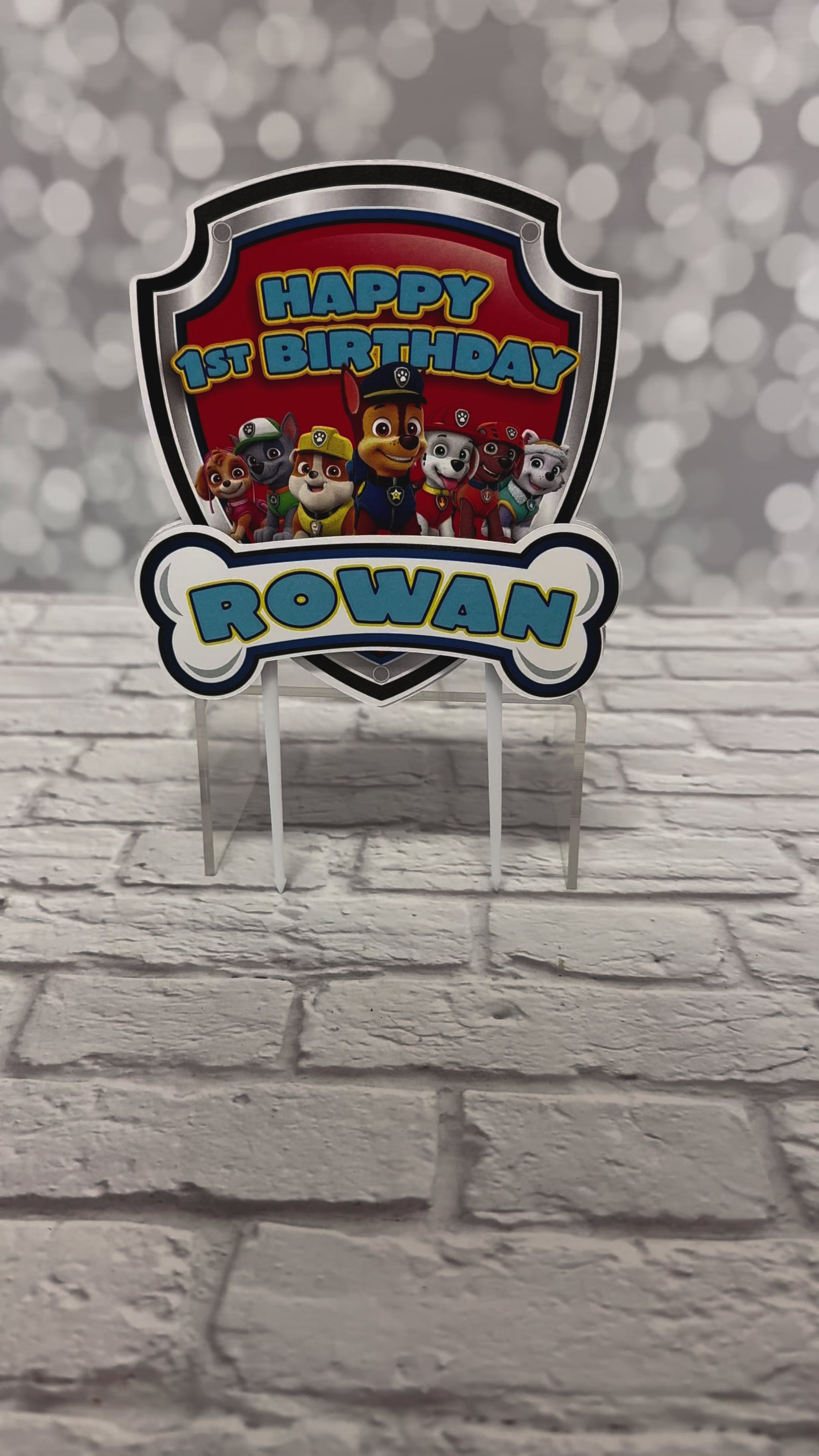 Our birthday cake topper is personalized for your little birthday girl or birthday boy and double-sided for full impact from every angle and super fun 3D aspect with the addition of another "dog bone" printed with your child's name. Measures approximately 5 inches wide and 5.5 inches tall. Personalized to match your theme and make your cake table extra special! Featuring your favorite paw patrol heroes, Chase, Rocky, Skye, Rubble, Marshall, Zuma, Everest.